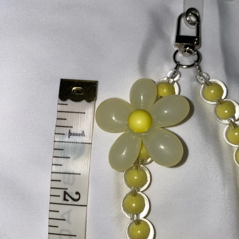 1-wrist lanyard for cells, keys and more Yellow Oversized Flower Charm